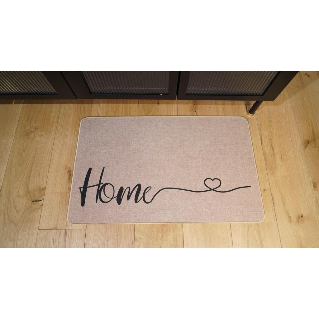 שטיח דגם טנסי עשוי בד ושילוב גומי עם כיתוב HOME בצבע שחור